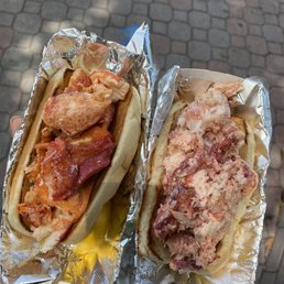 two hot dogs wrapped in foil two hot dogs wrapped in foil