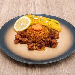 Masarap Cafe - Oven-Baked Salmon with jollof rice served with salad. Very exceptional.