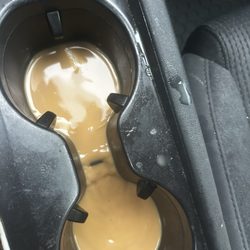 Dunkin’ - Coffee in my cup holder from a cracked cup they gave me and refused to refund.