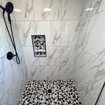SCT Flooring - Modern mixed with class with these 24"x24" polished marble look a like tile in this shower - Flooring Near Me