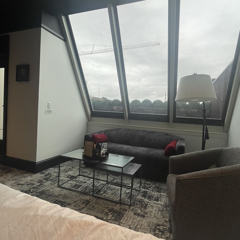 Bottleworks Hotel - Sitting Area with View of the Terrace (door to the private terrace is to the left.) - Hotels Near Me - Indianapolis, Indiana