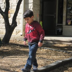 Blue Roof School - Crossing the body mid line is "work" for a young child.