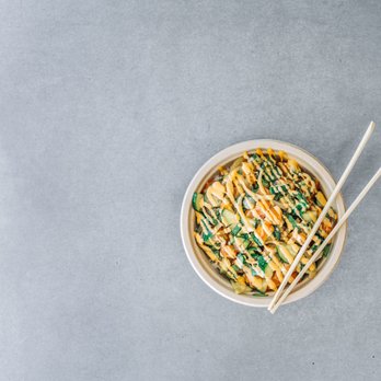 The Poké Company - a bowl of noodles with chopsticks - Poke Near Me - Delray Beach, Florida The Poké Company - a bowl of noodles with chopsticks - Poke Near Me - Delray Beach, Florida