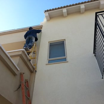 Boise's Best Lawn Care - a man on a ladder working on a house - Landscaping Near Me - Boise, Idaho Boise's Best Lawn Care - a man on a ladder working on a house - Landscaping Near Me - Boise, Idaho