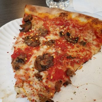 Il Mattone - Mushroom slice missing a bite - Italian Near Me - New York, New York