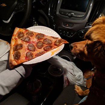 More Home Slice Pizza - Sausage and Garlic Slice, $4.25 prior to tax. Please note that cute dog does not come with pizza slice - Pizza Near Me - Austin, Texas More Home Slice Pizza - Sausage and Garlic Slice, $4.25 prior to tax. Please note that cute dog does not come with pizza slice - Pizza Near Me - Austin, Texas