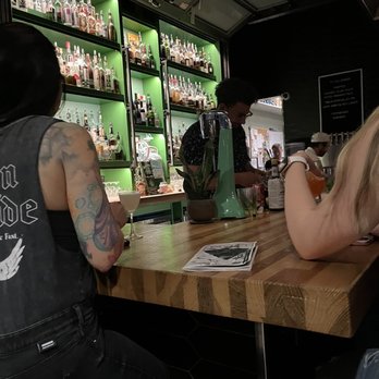 Water Witch - a man and a woman sitting at a bar - Cocktail Bars Near Me - Salt Lake City, Utah Water Witch - a man and a woman sitting at a bar - Cocktail Bars Near Me - Salt Lake City, Utah
