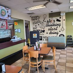 Basil pizza - A view of one of the tables and the ordering counter.
