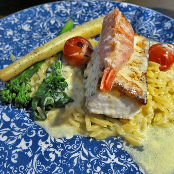 Ristorante a Mano - Pan Seared Atlantic Halibut, wild  Argentinian Shrimp, lemon beurre  blanc, charred tomatoes, herbed orzo, sautéed greens - Italian Near Me - Halifax, Nova Scotia