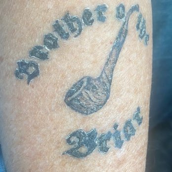 Red Rooster Tattoo - This was just a few weeks after it was done and recently it's worse with the holes in the letters almost completely filled in like blobs. - Tattoo Near Me - Longview, Texas