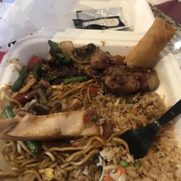 Plate with 1/2 noodle and 1/2 rice. Angus steak and teryaki chicken as spring roll. Plate with 1/2 noodle and 1/2 rice. Angus steak and teryaki chicken as spring roll.