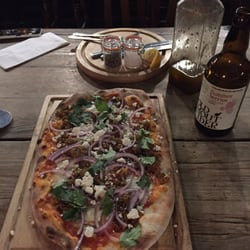 Turkish pizza with lamb, red onions, and feta cheese. Delicious!