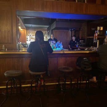 Bar 414 - a group of people sitting at a bar - Cocktail Bars Near Me - San Antonio, Texas