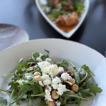 Atlantic Grille - a plate of salad and a glass of wine - Seafood Near Me - Palm Coast, Florida