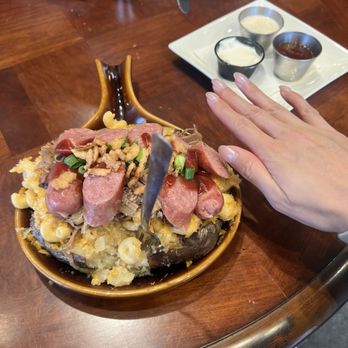 NorthWest Salmon Smokehouse - Epic Baker with hand for reference - Cafes Near Me - Chehalis, Washington