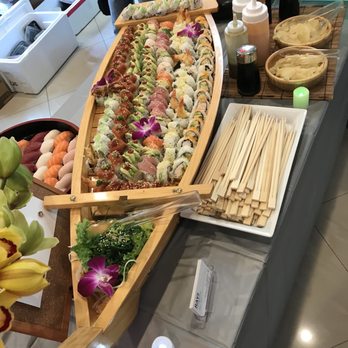 Ray's Sushi Catering - Sushi boat presentation with sauces wasabi and ginger - Caterers Near Me - Baldwin Park, California