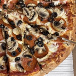 Porky's Pizza - Pepperoni, black olive, and mushroom pizza