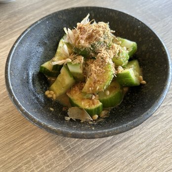 Domo Domo - Cucumber Salad - Fresh cucumber in soy garlic vinaigrette, bonito flakes, crispy arare - Japanese Near Me - Ewa Beach, Hawaii Domo Domo - Cucumber Salad - Fresh cucumber in soy garlic vinaigrette, bonito flakes, crispy arare - Japanese Near Me - Ewa Beach, Hawaii