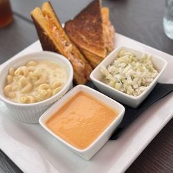 Pipe Creek Wharf - Lobster grilled cheese with sides of spicy macaroni and cheese, lobster bisque and apple slaw.