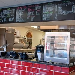 Gino Bros Pizza Express - Offers pizza by the slice.