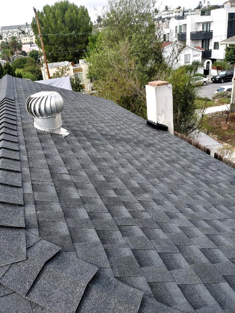 Slide of Father And Son Roofing.