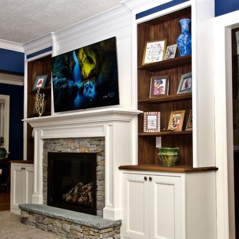Rizzo Brothers Construction - a living room with built in bookshelves and a fireplace - General Contractors Near Me Rizzo Brothers Construction - a living room with built in bookshelves and a fireplace - General Contractors Near Me