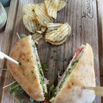 Encanto Cafe - Prosciutto, pesto, Brie cheese, arugula, tomato on ciabatta bread. - Cafes Near Me - San Diego, California Encanto Cafe - Prosciutto, pesto, Brie cheese, arugula, tomato on ciabatta bread. - Cafes Near Me - San Diego, California