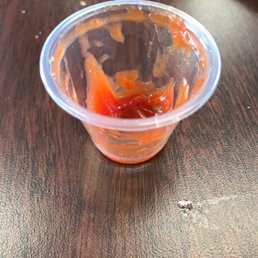 Almost empty container of ketchup Almost empty container of ketchup
