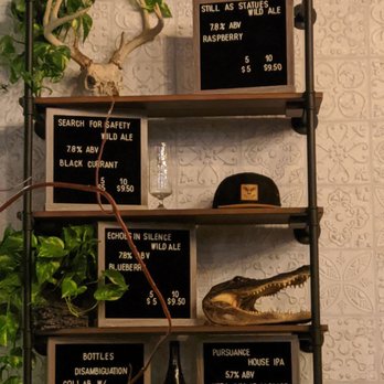 Unseen Creatures Brewing - Cool menu display behind the bar of their own brews - Breweries Near Me - Miami, Florida Unseen Creatures Brewing - Cool menu display behind the bar of their own brews - Breweries Near Me - Miami, Florida