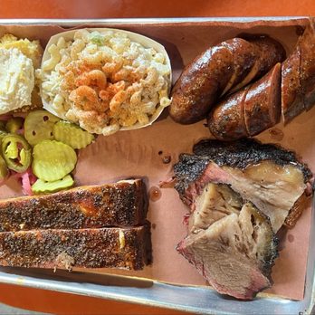 Smokin Petes - The Pit Trio: Sausage, brisket, ribs with mac salad & cornbread - Barbeque Near Me - Geneva, New York Smokin Petes - The Pit Trio: Sausage, brisket, ribs with mac salad & cornbread - Barbeque Near Me - Geneva, New York