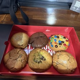 Top row left to right: chocolate chip sea salt, brownie, M&M Bottom row left to right: reesces PB, pistachio knafa, reesces PB