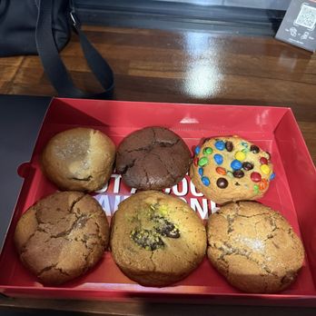 Problem Baker - Top row left to right: chocolate chip sea salt, brownie, M&M Bottom row left to right: reesces PB, pistachio knafa, reesces PB - Bakeries Near Me - Staten Island, New York