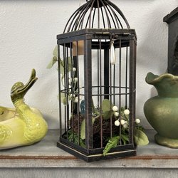 Antique pitchers and unique small birdcage for home decor