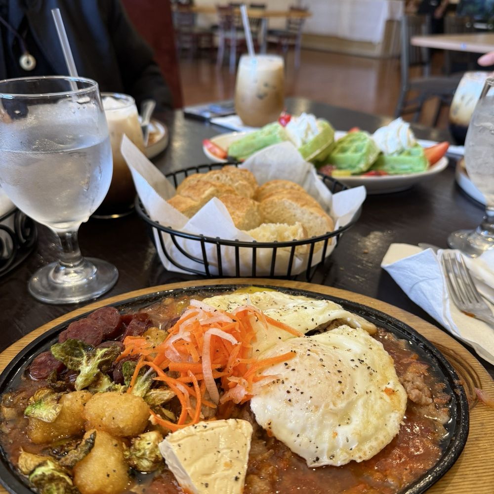 Evergreen Breakfast - Banh mi skillet and pandan waffles in the back. Couldn't resist taking a bite first, oops - Breakfast & Brunch Near Me - San Jose, California Evergreen Breakfast - Banh mi skillet and pandan waffles in the back. Couldn't resist taking a bite first, oops - Breakfast & Brunch Near Me - San Jose, California