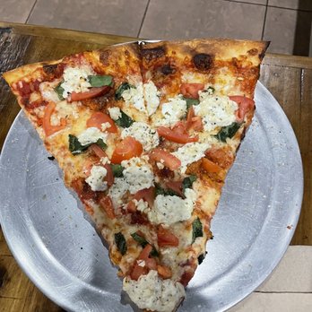 Arizona Pizza Company - a slice of pizza on a plate - Pizza Near Me - Tucson, Arizona Arizona Pizza Company - a slice of pizza on a plate - Pizza Near Me - Tucson, Arizona