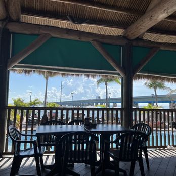 Sunset Grille & Raw Bar - Tiki seating overlooking pool - Seafood Near Me - Marathon, Florida Sunset Grille & Raw Bar - Tiki seating overlooking pool - Seafood Near Me - Marathon, Florida