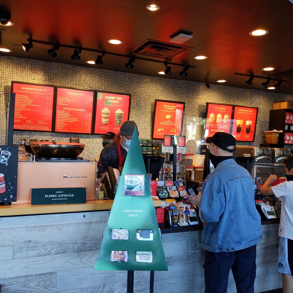 customers at the counter of a coffee shop