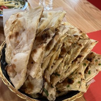 Rajni Indian Cuisine - Assorted Naans - Indian Near Me - Suwanee, Georgia Rajni Indian Cuisine - Assorted Naans - Indian Near Me - Suwanee, Georgia