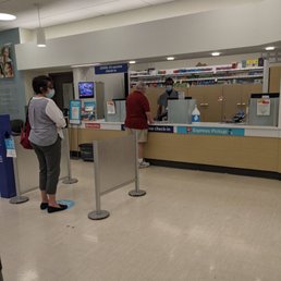 customers at the check - in counter customers at the check - in counter