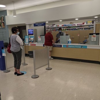 Walgreens - customers at the check - in counter - Drugstores Near Me - Chicago, Illinois Walgreens - customers at the check - in counter - Drugstores Near Me - Chicago, Illinois
