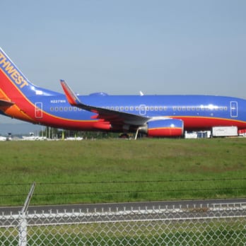 Southwest Airlines - A Southwest B-737 shining brightly on an atypically sunny day and at an atypical spot at PDX (near the cell phone waiting lot) - Airlines Near Me - Dallas, Texas Southwest Airlines - A Southwest B-737 shining brightly on an atypically sunny day and at an atypical spot at PDX (near the cell phone waiting lot) - Airlines Near Me - Dallas, Texas