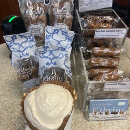 Traditional Vanilla Ice Cream on a Waffle Cone. Other goodies and treats in the background. Traditional Vanilla Ice Cream on a Waffle Cone. Other goodies and treats in the background.