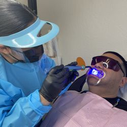 Luxury White Teeth Whitening - Preparing gums and teeth prior to 1 hour session.