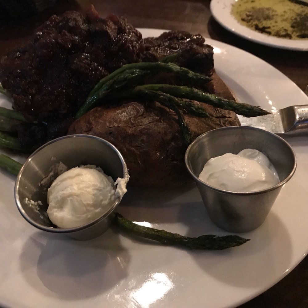Jeffrey's - Braised Short ribs with bake potato and asparagus - Steakhouses Near Me - Mooresville, North Carolina Jeffrey's - Braised Short ribs with bake potato and asparagus - Steakhouses Near Me - Mooresville, North Carolina