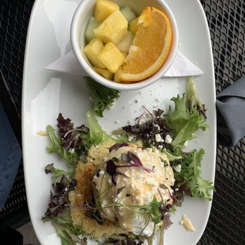 B Matthews Eatery - Fried green tomato crab cake benedict with a side of fruit - New American Near Me - Savannah, Georgia