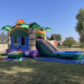 Horsetown Jumper Rentals - Tropical bounce house with water slide attachment. - Bounce House Rentals Near Me Horsetown Jumper Rentals - Tropical bounce house with water slide attachment. - Bounce House Rentals Near Me