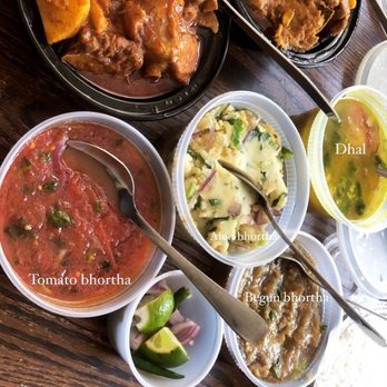 Korai Kitchen - Aloo Bhortha(middle), tomato bhortha (bottom), begun bhortha (right), tomato and potato chicken curry (left) and regular chicken curry (top) - Bangladeshi Near Me - Jersey City, New Jersey Korai Kitchen - Aloo Bhortha(middle), tomato bhortha (bottom), begun bhortha (right), tomato and potato chicken curry (left) and regular chicken curry (top) - Bangladeshi Near Me - Jersey City, New Jersey