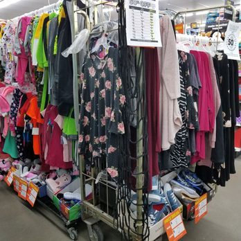 Dollar General - a rack of clothing in a store - Discount Store Near Me - Whitehouse, Ohio
