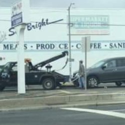 Sea Bright Supermart - Towing cars that parked overnight due to floods