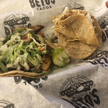 Beto's Tacos - Fish taco on left. Half eaten Tinga on right. - Tacos Near Me - Suwanee, Georgia